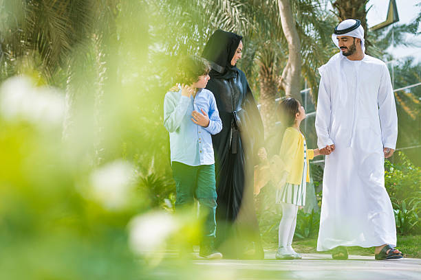 A family enjoys a sunny day in Dubai, highlighting the allure of living and working in this city for freelancers.