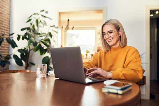 A freelancer works on a laptop at home, highlighting the ease of remote work with a freelance visa in Dubai.